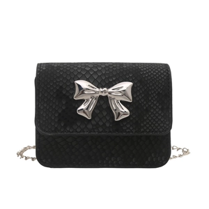 Black snake pattern crossbody bag with a silver metal bow and elegant chain strap