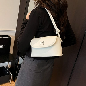 Elegant white crossbody shoulder bag with a silver bow knot decoration for women