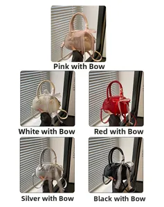 Detail view of mini Boston bag collection with embossed bows and lace charms in five colors