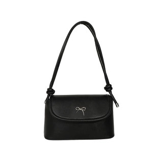 Classic black leather underarm bag with silver bow ornament and knotted shoulder strap