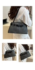 Detail view of charcoal gray shoulder bag with retro belt buckle and silver eyelets