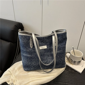 Minimalist navy denim tote bag with white polka dots and silver metallic leather handles