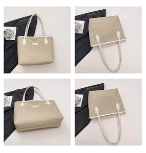 Detail view of woven texture and shoulder straps on beige large capacity tote bag
