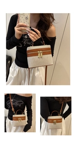 Three-way view of a beige canvas box bag with brown leather trim and dual zippers