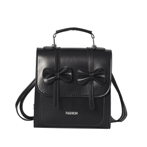 Minimalist black PU leather backpack for women with decorative bows and top handle design