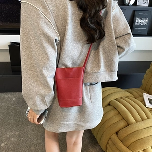 Red lychee pattern leather mini crossbody bag for women in a minimalist vertical style