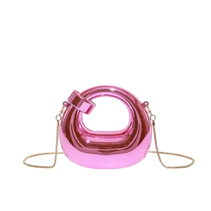 Mini acrylic pink metallic tote bag with gold chain strap in modern glossy finish