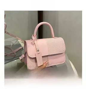 Pink patchwork crossbody bag with woven texture and Fashion & Bags charm detail