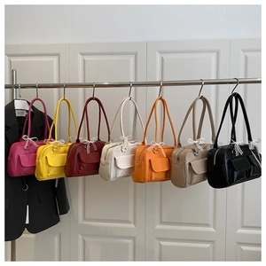 Boston style shoulder bags in seven colors with elegant lace bow detail and PU finish