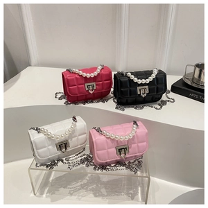 Mini quilted crossbody bags with pearl handles and chain straps in four trendy colors