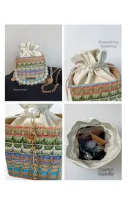 Detail view of woven bucket bag with pearl handle, drawstring closure and chain strap