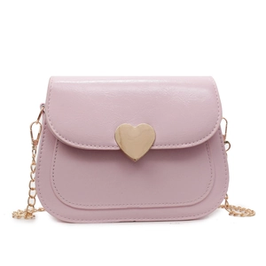 Pink PU leather crossbody bag with heart-shaped gold clasp and chain strap on white background