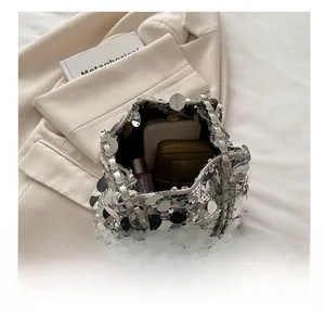 Overhead view showing the spacious interior of the silver sequin bucket bag for essentials