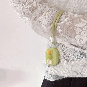 Light green silicone AirPods case with a braided hand strap and colorful decorative buttons