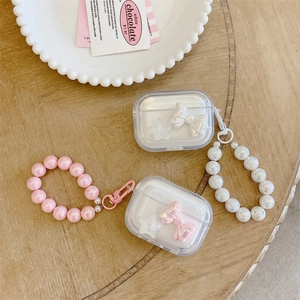 Transparent AirPods Pro case with pink bow, star charm and large pearl wrist strap