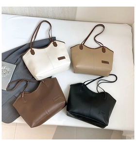 Flat lay of large capacity PU leather tote bags in white, beige, brown, and black