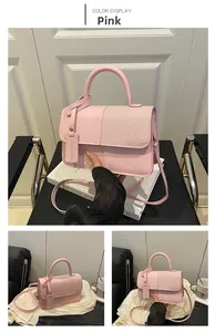 Pink crossbody bag detail showing mixed textures of smooth leather and fine weaving