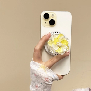 Close-up of 3D shell flower phone socket with yellow petals and pearl center detail