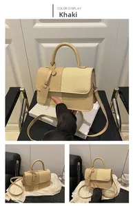 Detail view of khaki leather and woven straw textures on a contrast retro handbag