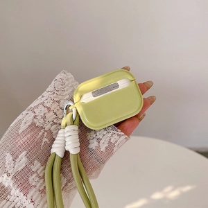 Detail of green silicone earphone case with a stylish braided lanyard and metal clip