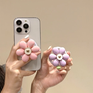 Pink and purple flower magnetic phone grip with golden heart on white iPhone