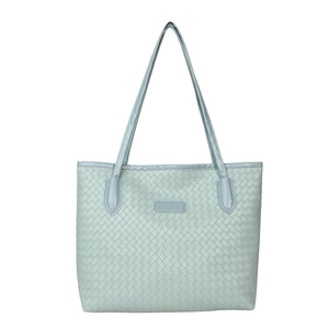 Mint green woven tote bag with long shoulder straps and central brand plaque on white background