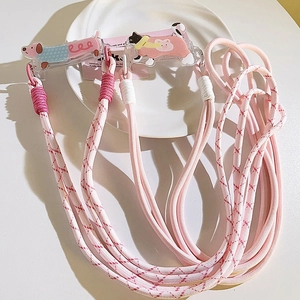 Pink and red woven crossbody phone lanyard with cute cartoon puppy acrylic clips
