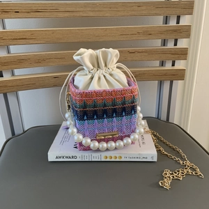 Chic multi-color woven bucket bag with pearl handle and gold chain for women