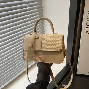 Minimalist beige leather and straw patchwork handbag with top handle and strap for women
