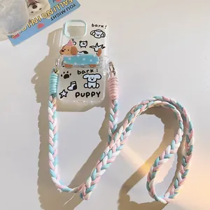 Detail of cute puppy phone case with 3D stand and blue pink braided crossbody lanyard