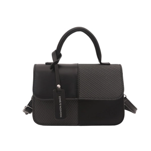 Minimalist vintage black crossbody bag with mixed textures and fashion hangtag