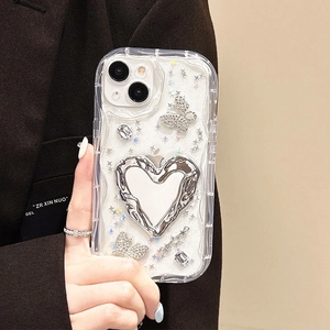 Close-up of wavy iPhone case featuring silver mirror heart, rhinestone butterfly and glitter