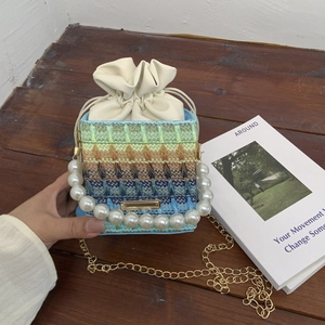 Colorful bohemian knit bucket bag with pearl handle and golden chain strap