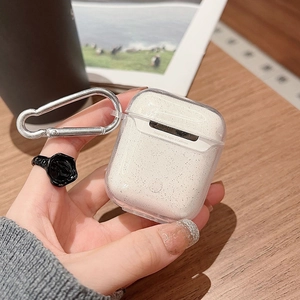 Glitter transparent case for AirPods featuring a silver carabiner and soft bow design