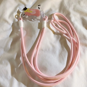 Pink woven phone lanyard with cute cat acrylic clip on white fabric background