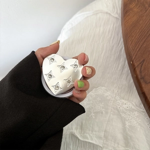 Portable heart-shaped silver phone grip with sparkling star rhinestones on metallic finish