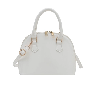 Minimalist white shell-shaped crossbody bag with gold zippers and adjustable shoulder strap