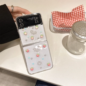 Detail of Galaxy Z Flip case with 3D resin strawberries, pearls and glitter elements