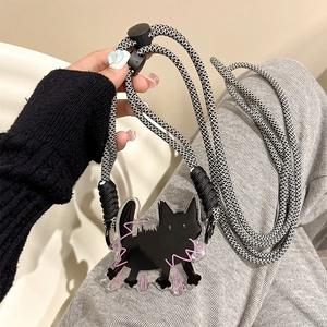 Detail of adjustable black and white braided crossbody phone strap with cat acrylic pendant