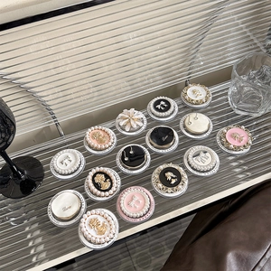 Detailed view of vintage cameo magnetic phone grips with faux pearl and bow accents