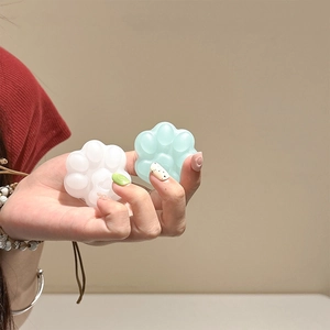 Cute jelly cat paw phone grip holder in translucent white and mint green colors