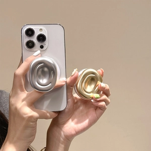 Minimalist geometric magnetic phone socket in gold and silver with metallic texture