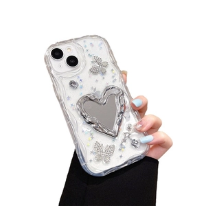 Sparkly iPhone case with heart-shaped makeup mirror and rhinestone butterfly charm
