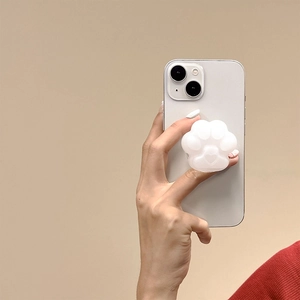Close-up of a cute pearl white cat paw pop socket on the back of a white smartphone