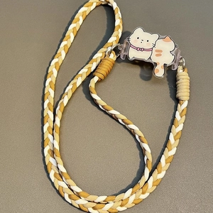 Detail of woven phone strap featuring a cute cat acrylic charm and metal connector