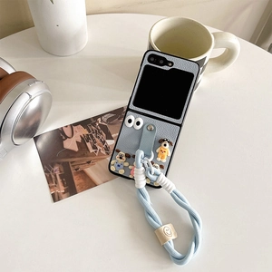 Light blue leather foldable phone case featuring cute cartoon dogs and hand strap
