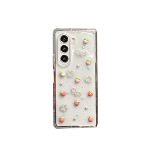 Glittery transparent case for Samsung Galaxy Z Fold with strawberry and pearl heart