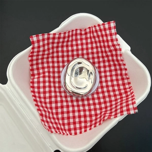 Vertical top view of silver fluid lava style ring on a transparent base with grid background