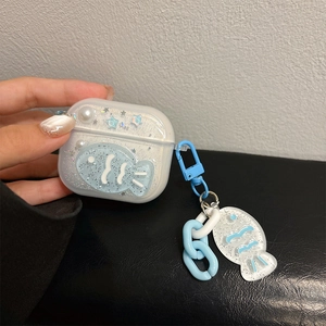 Detail of glitter Airpods case featuring blue fish charm and star pearl decorations
