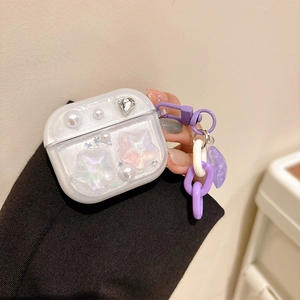 Glittery AirPods Pro case with pearls, stars, heart crystal, and a purple chain strap